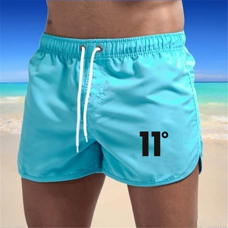 🏖️👖Módní pánské plavecké šortky s vícebarevným potiskem 2026